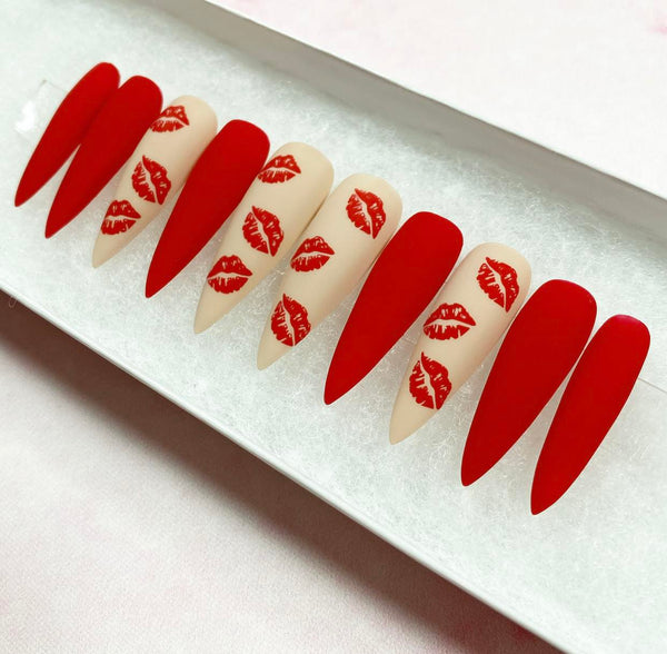 Load image into Gallery viewer, Handmade red and nude press-on nails with a red lips design, in a matte finish.