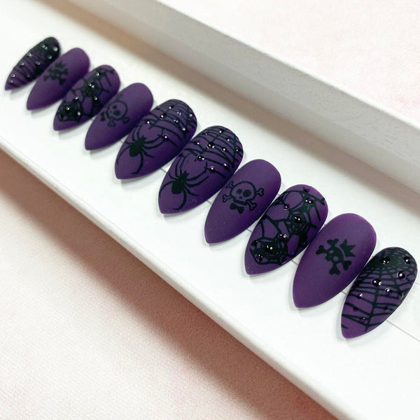Load image into Gallery viewer, Purple Halloween Gothic press-on nails with black skull, web and spider artwork and 3D raindrop design, handmade by Illuminate by Liana Press-On Nails UK.