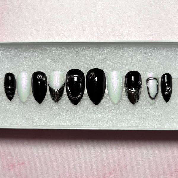 Load image into Gallery viewer, Gothic style black, white and silver chrome short stiletto press-on nails, with 3D silver chrome metallic tips on some nails and silver chrome design accents.