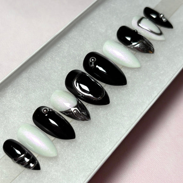 Load image into Gallery viewer, Set of black, white and silver chrome short stiletto press-on nails, with 3D silver chrome metallic tips on some nails and silver chrome design accents.