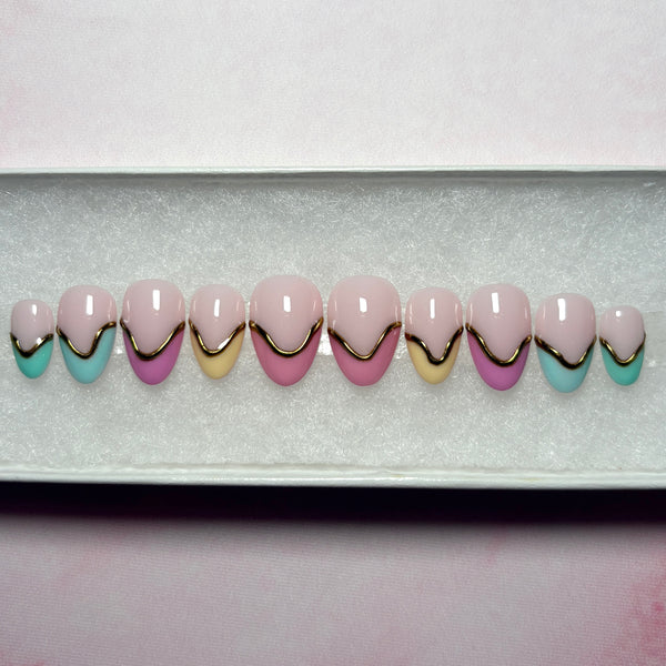 Load image into Gallery viewer, Summer handmade press-on nails in a French tip design, in a variety of soft pastel shades, featuring 3D gold chrome accents on each nail, in a short almond shape and displayed in a white presentation box.