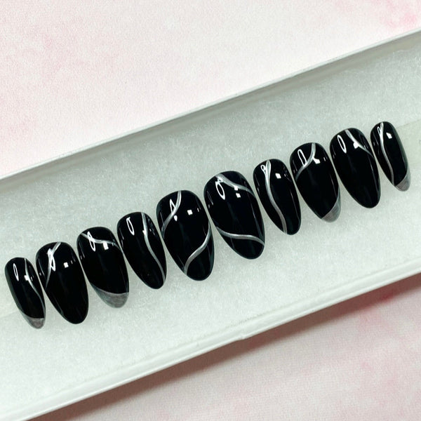 Load image into Gallery viewer, Silver chrome and black press-on nails in a white presentation box.