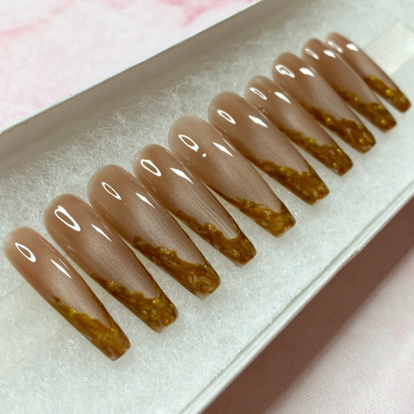 Load image into Gallery viewer, French tip press-on nails in light brown cat eye with gold-copper coloured French tips on each nail, in a long coffin shape, displayed in a white presentation box.
