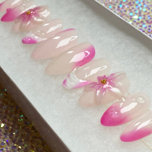 Load image into Gallery viewer, Pink and white artificial nails with 3D floral designs in a white presentation box.