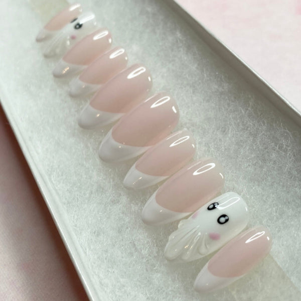 Load image into Gallery viewer, Halloween press-on nails in soft pink and white featuring French tip nails and two cute 3D ghost accent nails, displayed in a white presentation box.