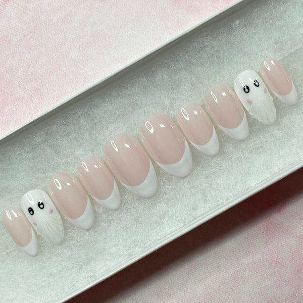 Load image into Gallery viewer, Halloween handmade press-on nails in a short almond shape, with French tips and two 3D ghost accent nails, in white and soft pink, displayed in a white presentation box.