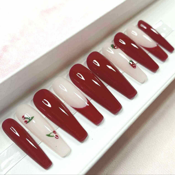 Load image into Gallery viewer, Long coffin press-on nails in deep red and soft pink with a spring-summer design of delicate cherries and strawberries on two of the nails, in a white presentation box.