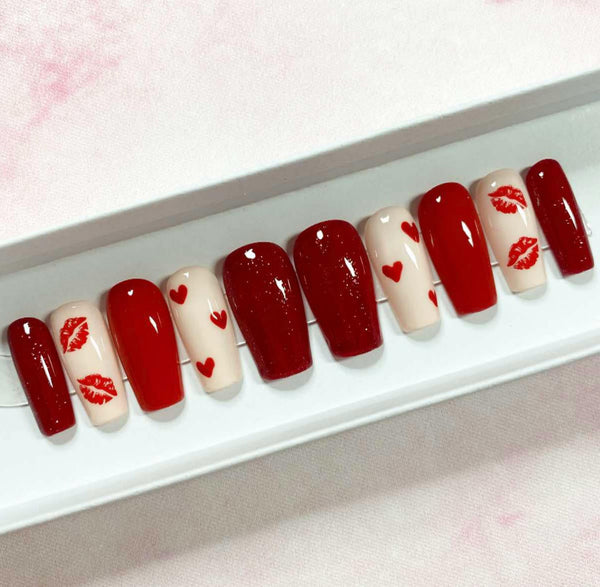 Load image into Gallery viewer, Valentine's handmade false nails in red and cream with red hearts and lips designs and red glitter