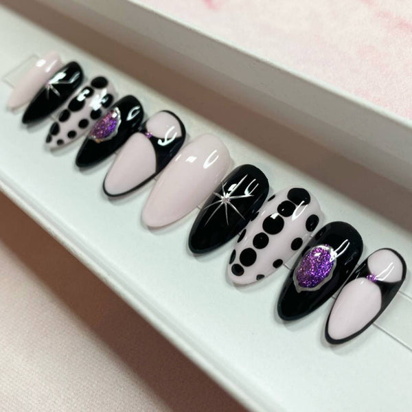 Load image into Gallery viewer, Handmade press-on nails in black, purple and pink with silver chrome stars, and purple glitter accents, and tiny purple rhinestones, in a white presentation box