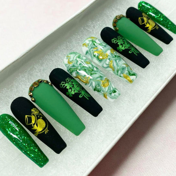 Load image into Gallery viewer, St Patrick's Day handmade press-on nails in green, black and gold with gold bird and green bouquet of shamrocks designs, rhinestones and glitter