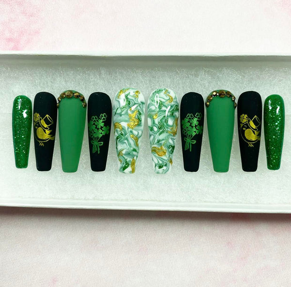 Load image into Gallery viewer, St Patrick's Day handmade false nails in green, black and gold with gold bird and green shamrocks designs, glitter and rhinestones
