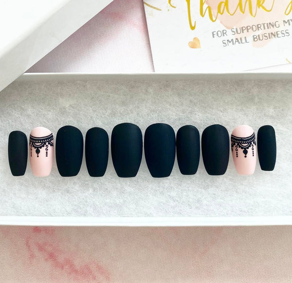 Load image into Gallery viewer, Short coffin black and pink press-on nails with a bohemian design of a necklace on the pink nails, in a white presentation box.