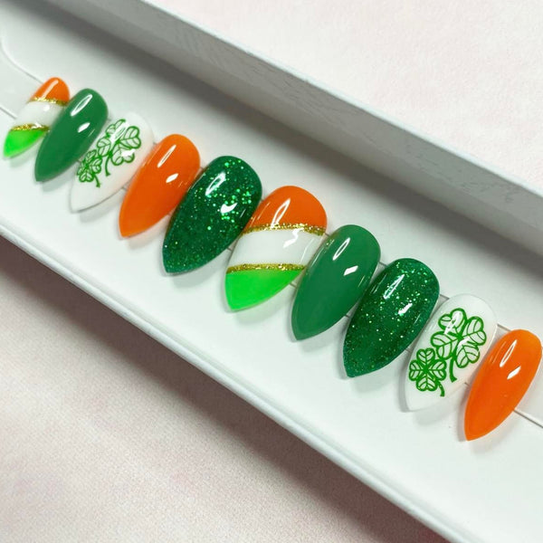 Load image into Gallery viewer, St Patrick's Day handmade press-on nails in green, orange, white and gold with a lucky clover design and green and gold glitter