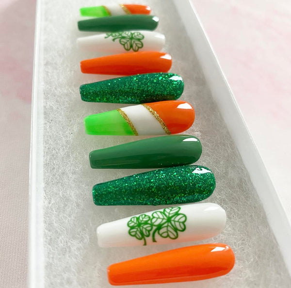 Load image into Gallery viewer, St Patrick's Day handmade press-on nails in vivid greens, orange, and gold with a lucky clover design and green and gold glitter