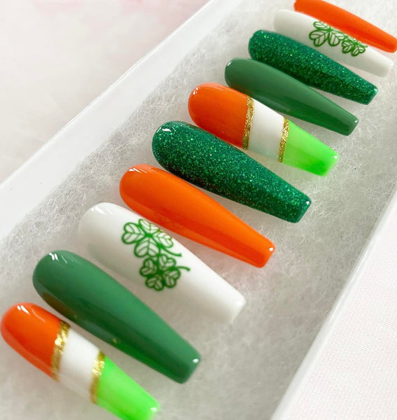 Load image into Gallery viewer, St Patrick's Day handmade press-on nails in green, orange, white and gold with lucky clover design and glitter, in a white presentation box