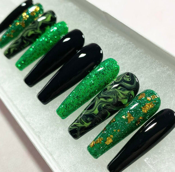 Load image into Gallery viewer, Press-on nails in green, black and gold, featuring a green and black marble design, gold-leaf/foil accents, and subtle glitter, handmade by Illuminate by Liana Press-On Nails UK.