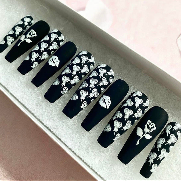Load image into Gallery viewer, Black and white matte handmade false nails decorated with white roses, lips, and heart-shaped lollipops artwork, in a white presentation box.