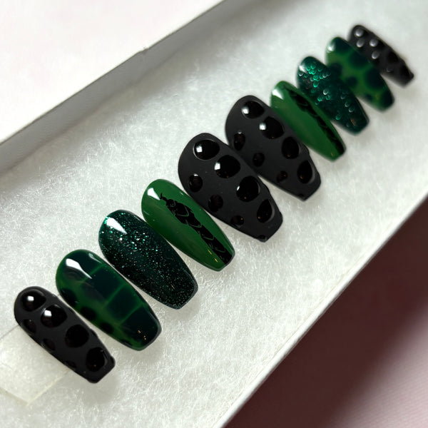Load image into Gallery viewer, Press-on gothic vibe false nails in black and deep emerald green, featuring a black snake design on a green background, snake print effect as 3D scales effect as well as subtle green glitter, handmade by Illuminate by Liana Press-On Nails UK.
