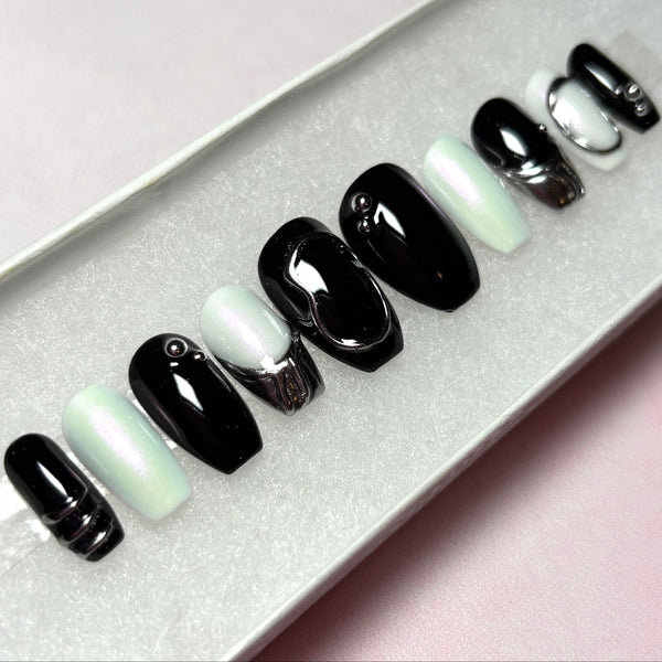 Load image into Gallery viewer, Short coffin shape black, white and silver chrome press-on nails, with 3D silver chrome metallic tips and designs. 
