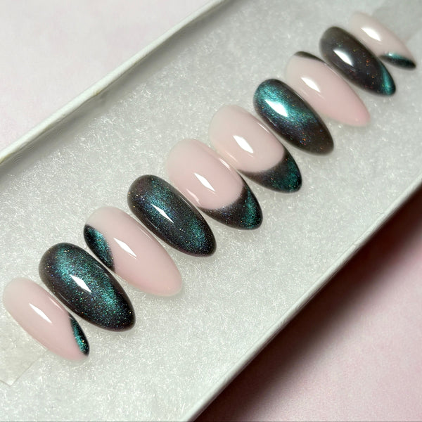 Load image into Gallery viewer, Set of almond shape cat eye press-on nails with shades of grey and green, on a soft pink base.
