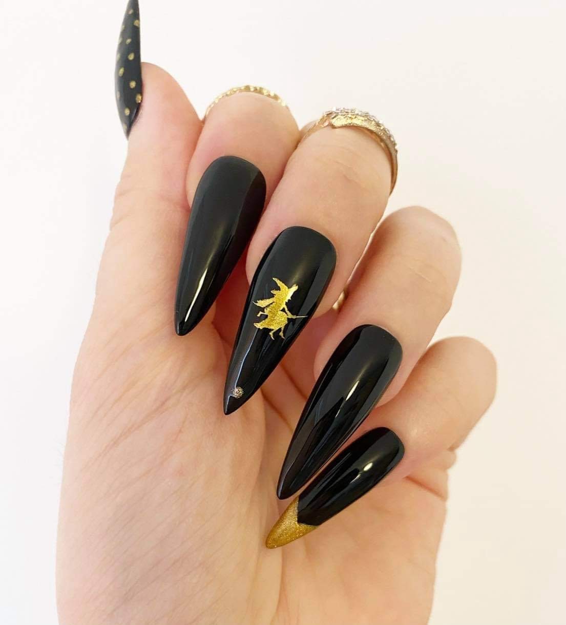 matte black and gold nails stiletto
